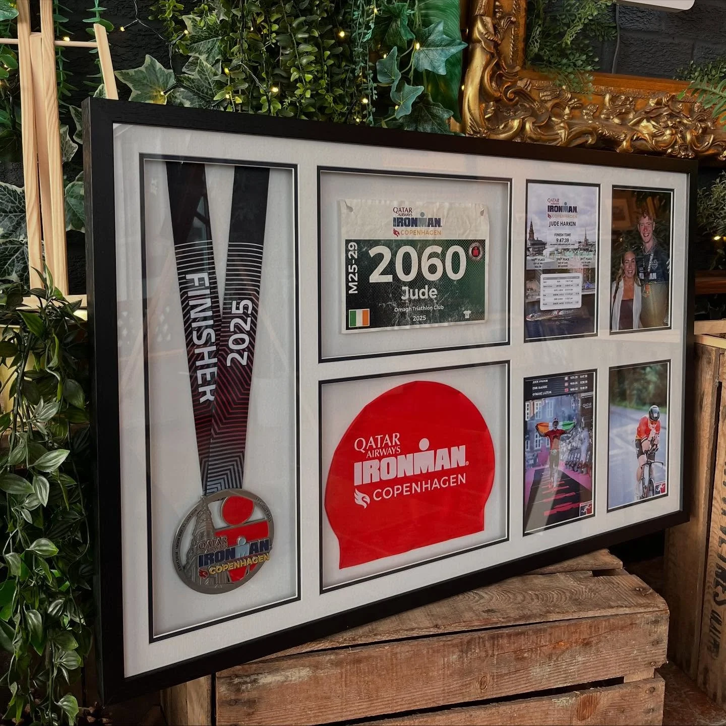 This one tells a full story 🏅🏊🏃

Medal, race number, swim cap and photos from an Ironman in Copenhagen 🇩🇰
A proper keepsake from a great achievement. Framed in a deep black frame and a navy and white double mount to enhance the colours and tie e