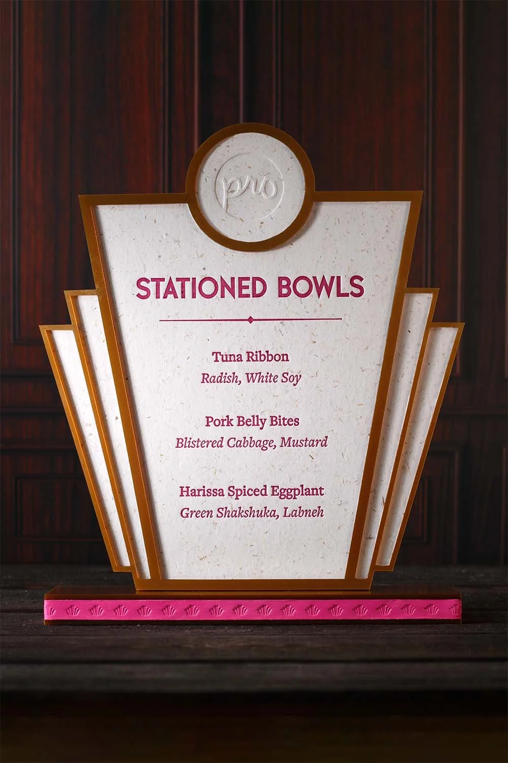 Art Deco-inspired wedding food station sign with layered acrylic details, embossed logo, and luxury event signage design by Lucasano Creative.
