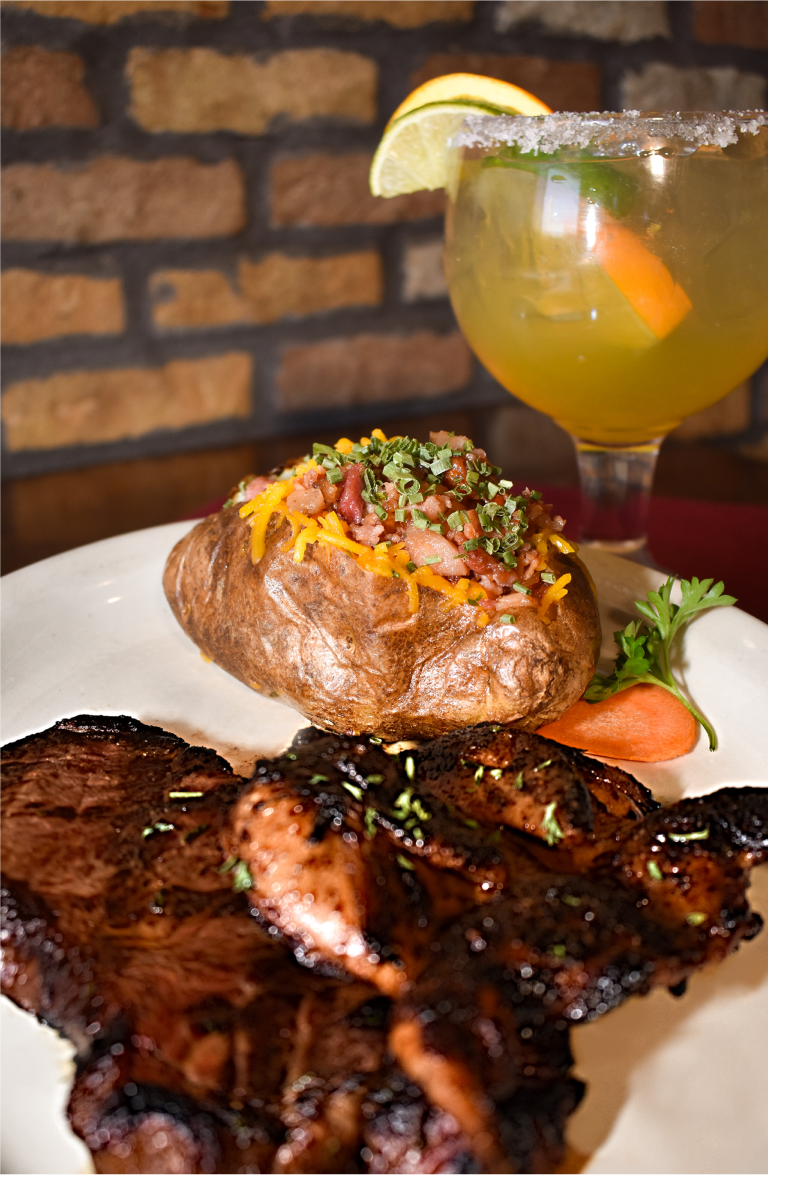 Steak and quail, paired with a margarita and a loaded baked potato
