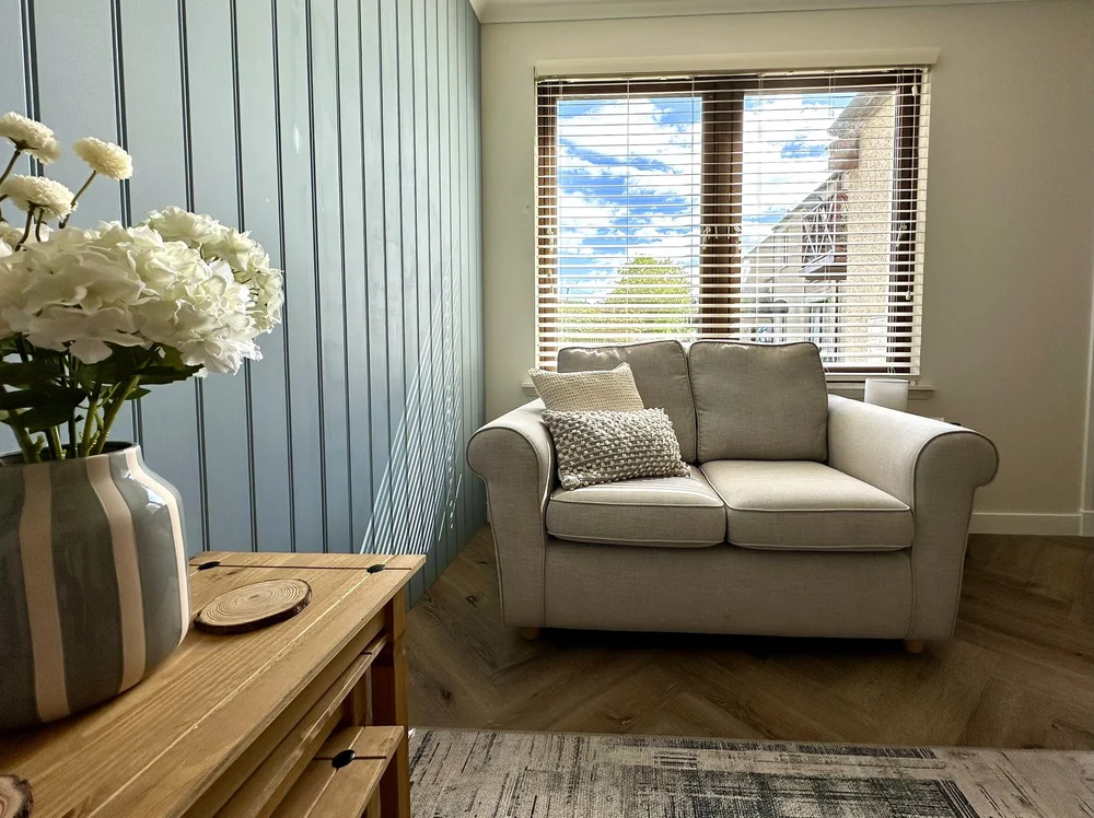 Living room with a sofa and wooden console table