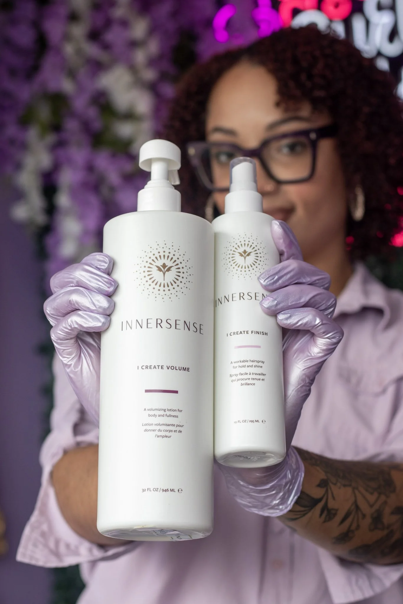Curl specialist and founder of Curly Colurz showcasing Innersense Organic Beauty curl products in her Crystal Lake studio
