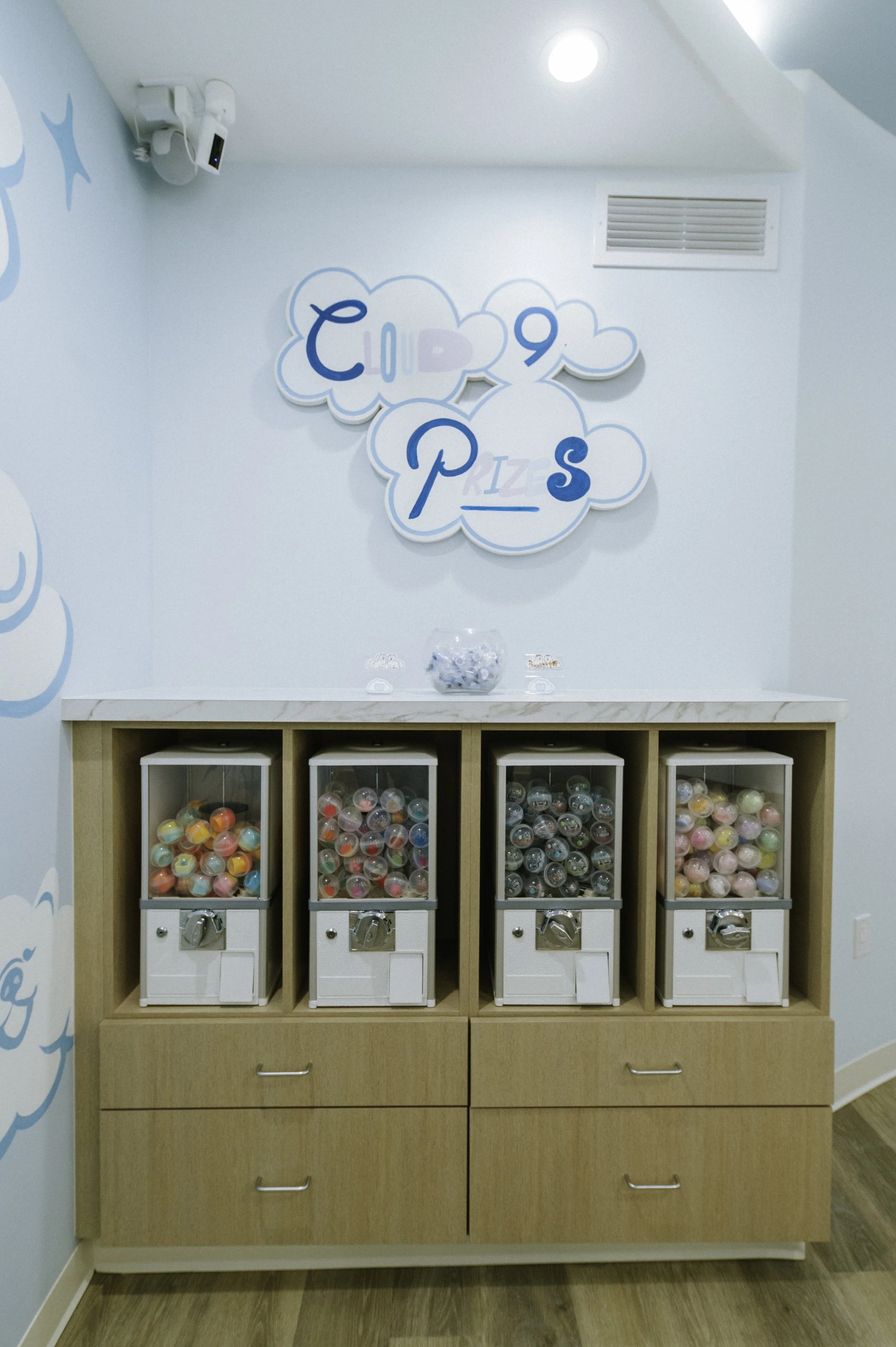 Little toys are dispensed with plugs given out by staff in the check out area.