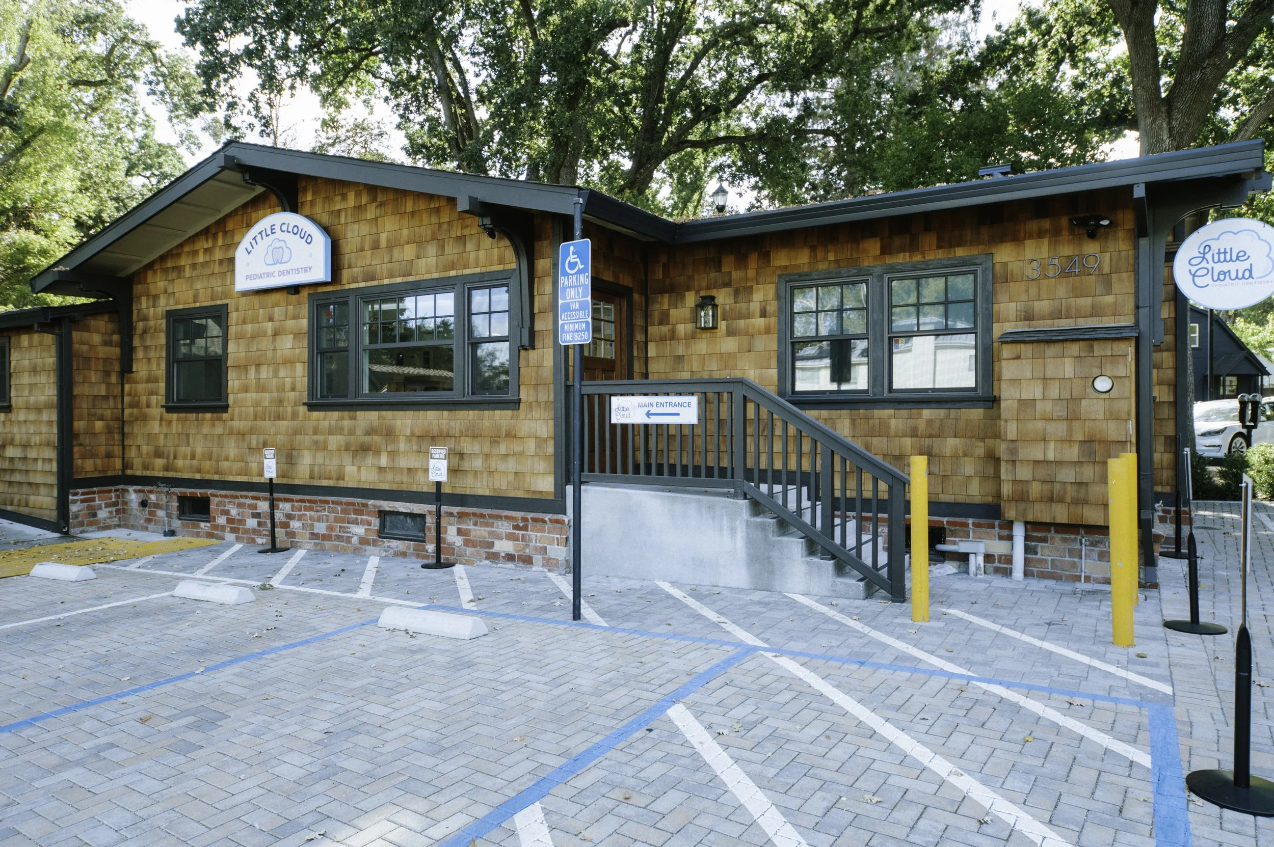 The exterior of the building was renovated with shingle siding and signage.