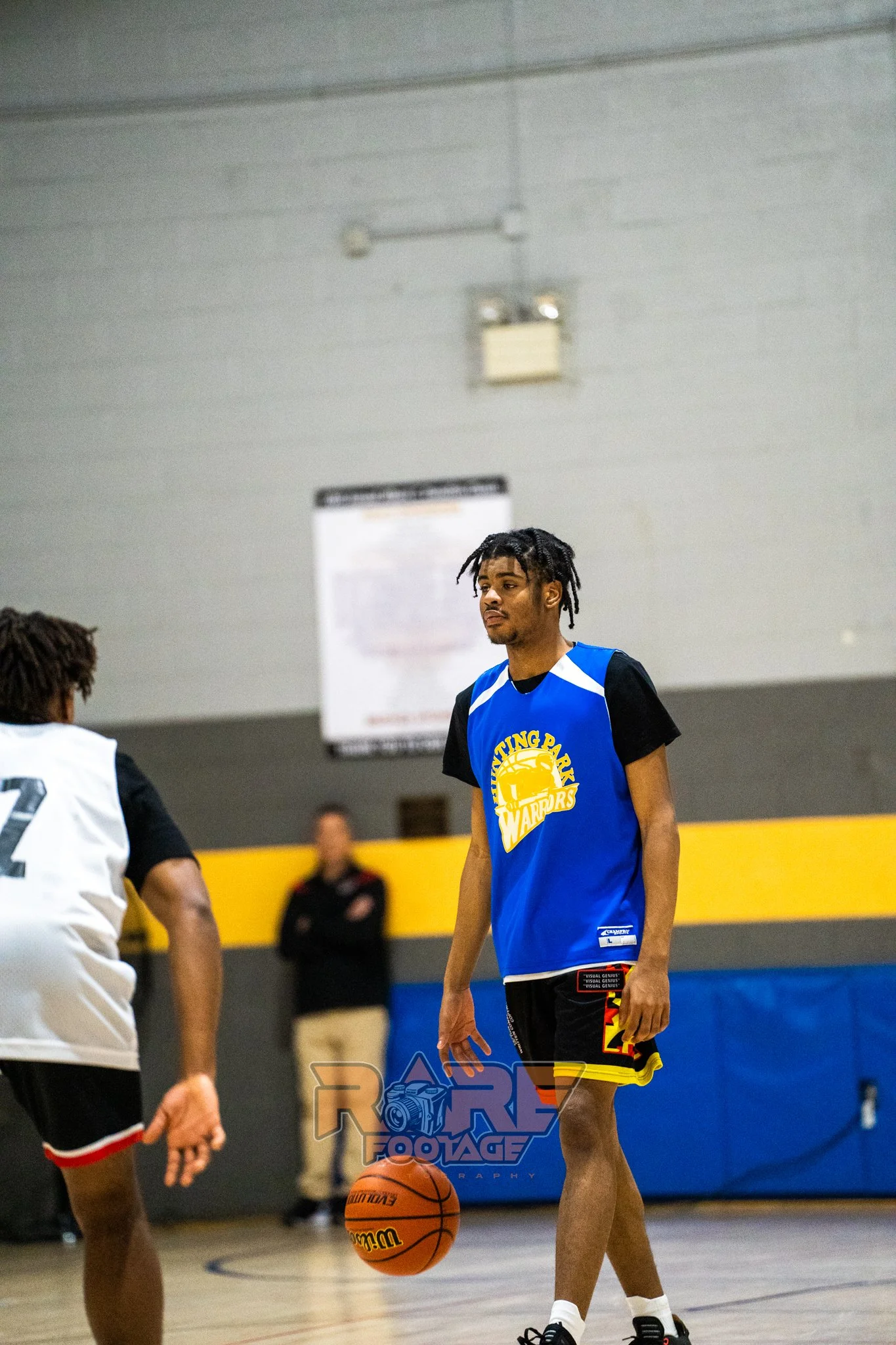 a portrait of a Hunting park youth, with a ball bouncing infant of him. 