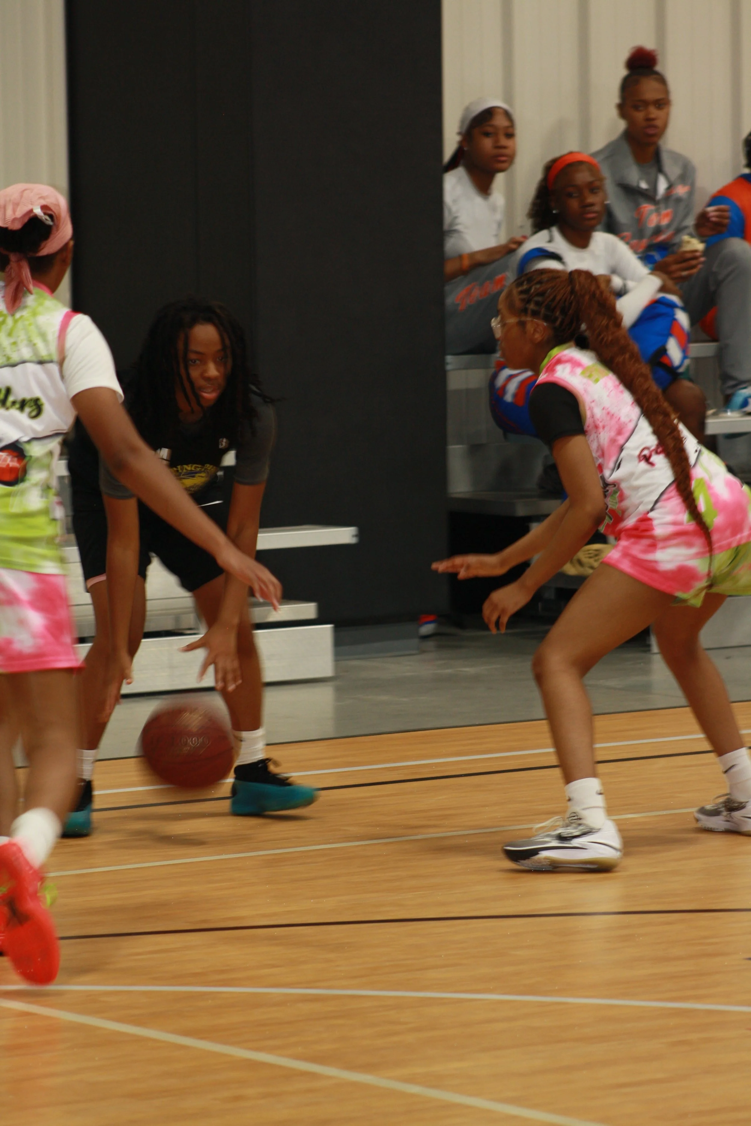 Youth female playing basketball.