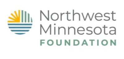 The logo of the Northwest Minnesota Foundation, featuring a circular graphic on the left composed of a yellow sunburst, green pine tree lines, and blue water waves, placed beside the stacked text "Northwest Minnesota FOUNDATION.