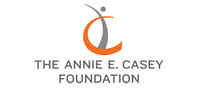 The logo of The Annie E. Casey Foundation, displaying an orange crescent arc paired with a stylized gray human figure with outstretched arms, set above the capitalized text "THE ANNIE E. CASEY FOUNDATION."