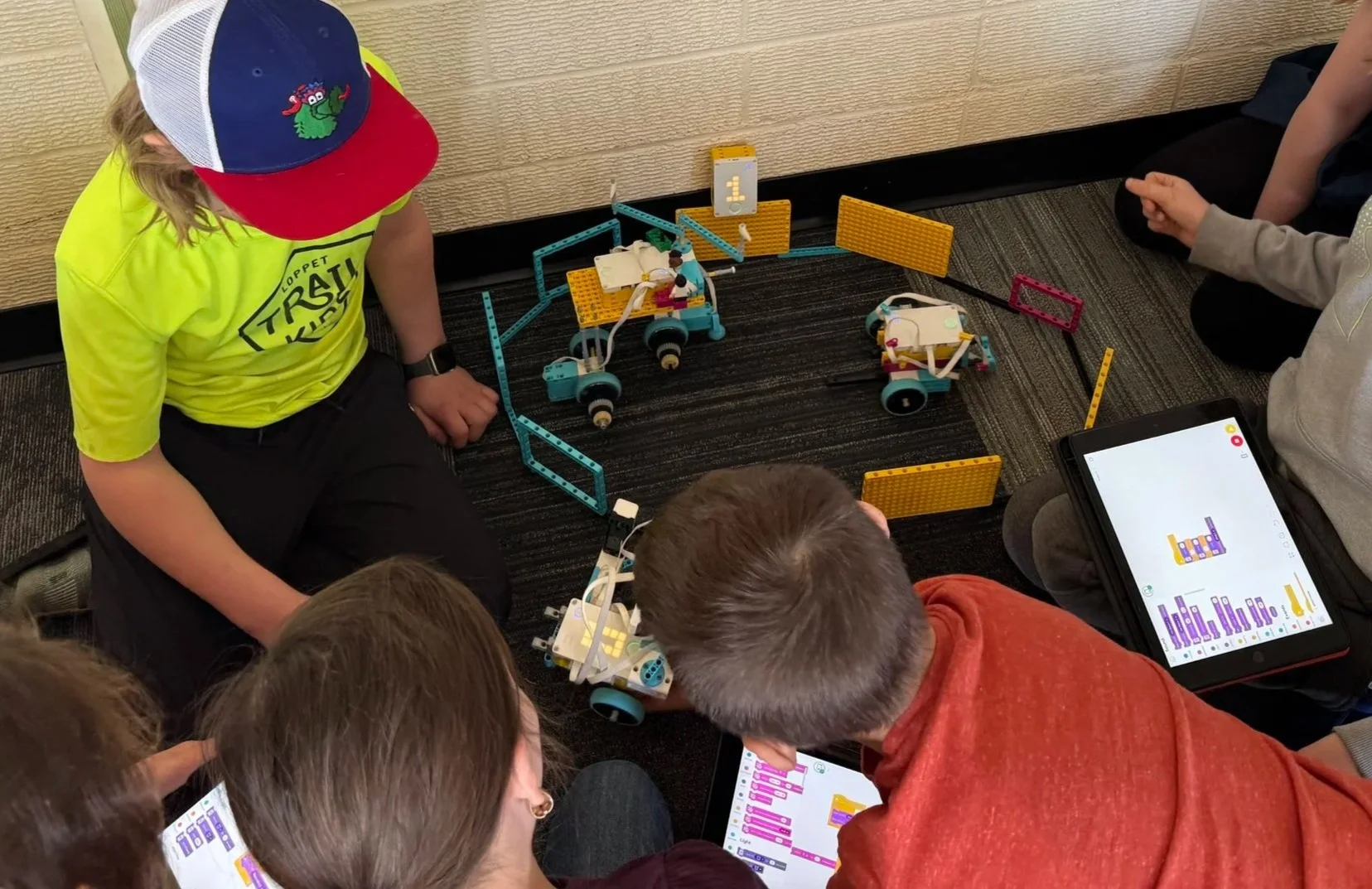 Navigators completing a Snapology project and battling with their completed Battle Bots!