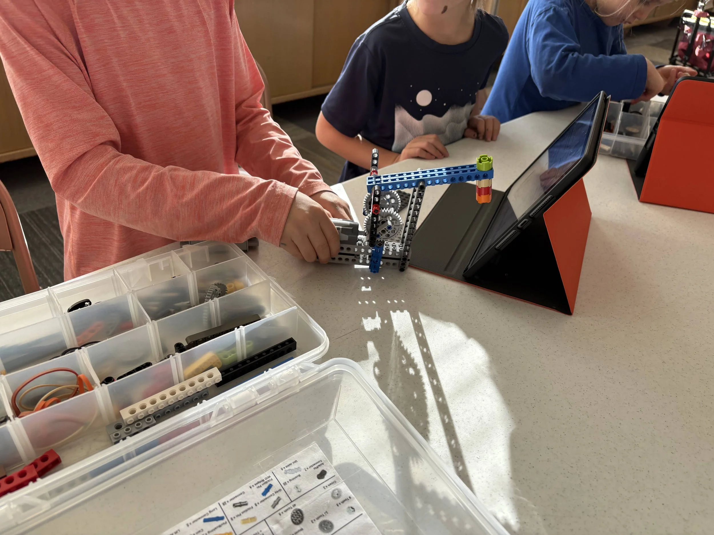 Mapmakers working on an engineering project with Snapology.