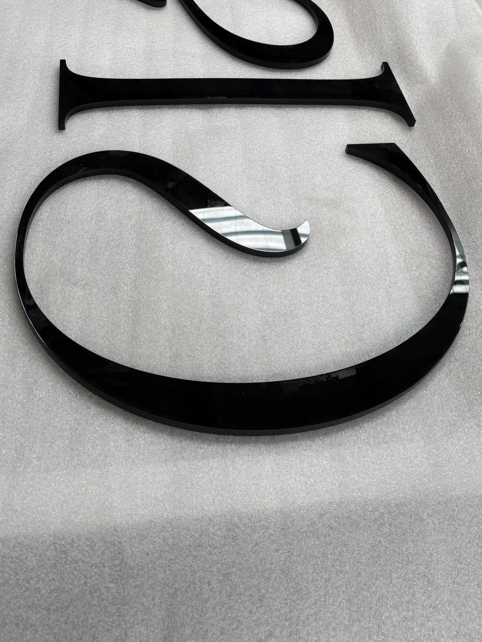 Company signage logo black gloss acrylic lettering