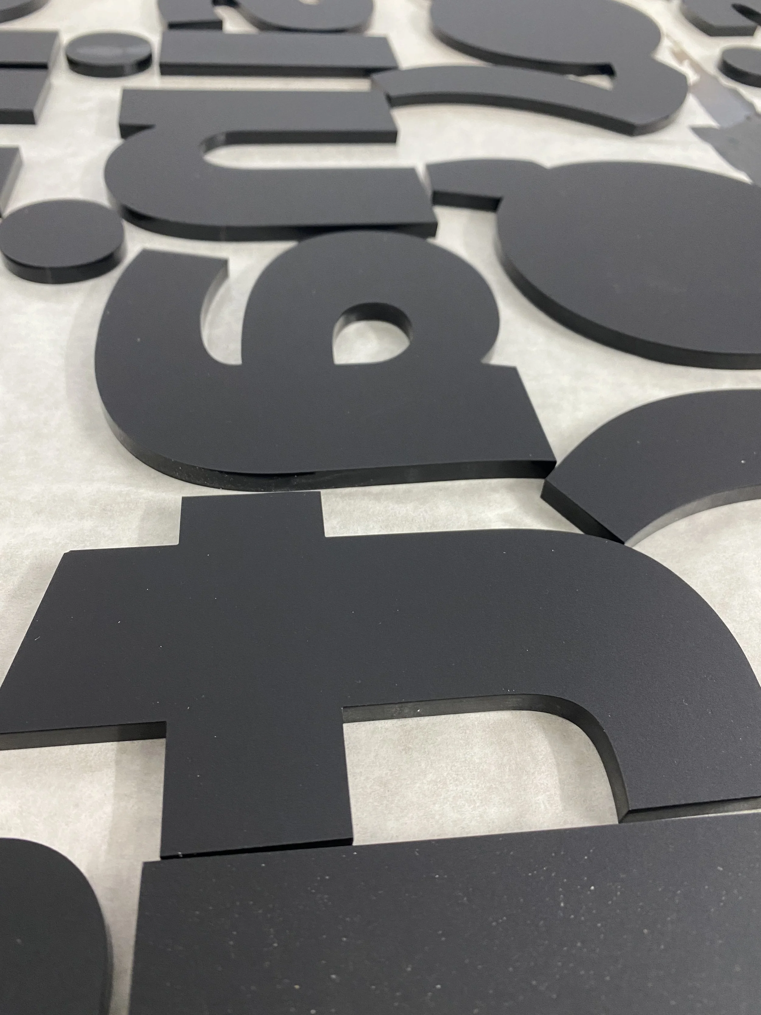 CO2 laser cut black letters and numbers