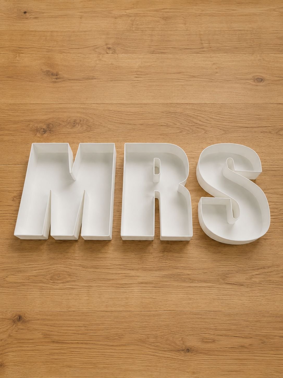 white MRS reusable box letters on a timber table