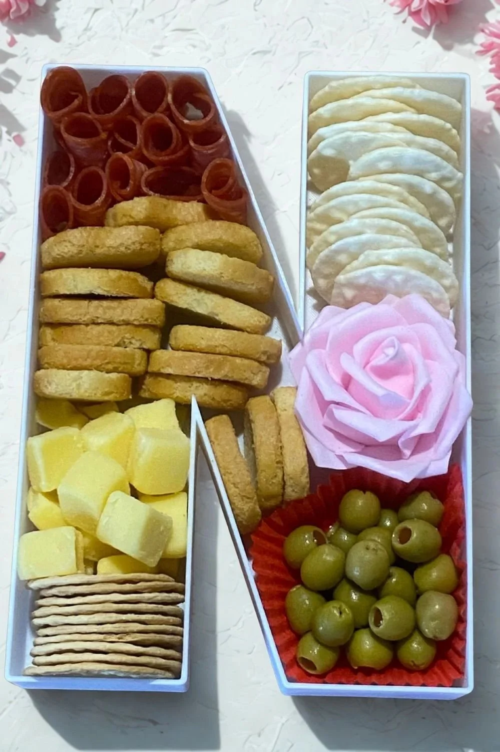 Fillable letter N food tray full of charcuterie food display products.jpg