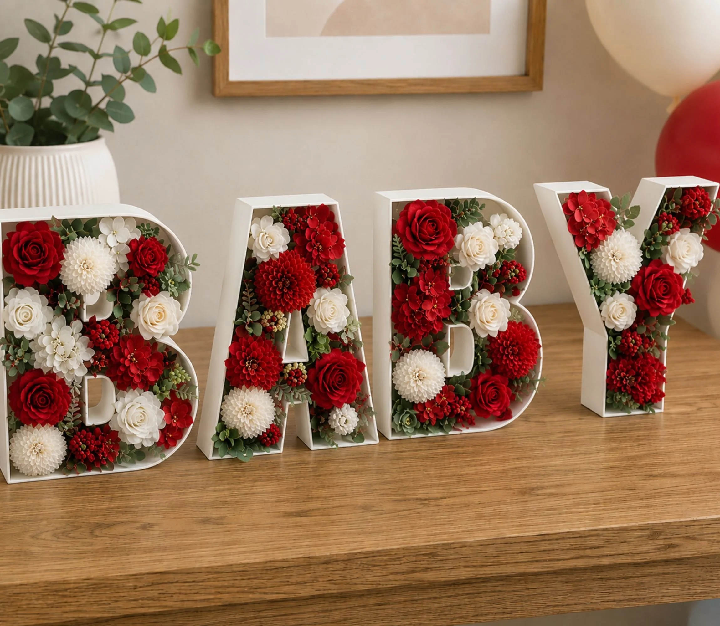 Red roses situated in the word baby for decoration and display for a party