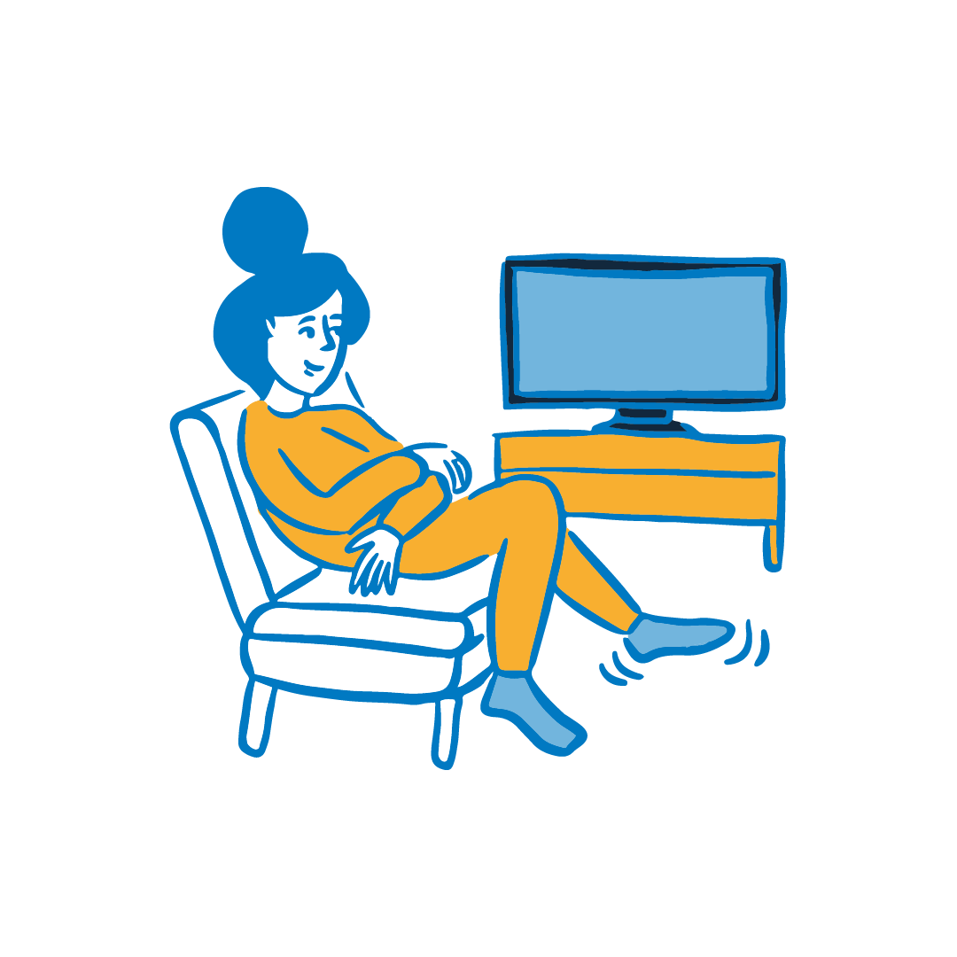 A woman sat watching TV.