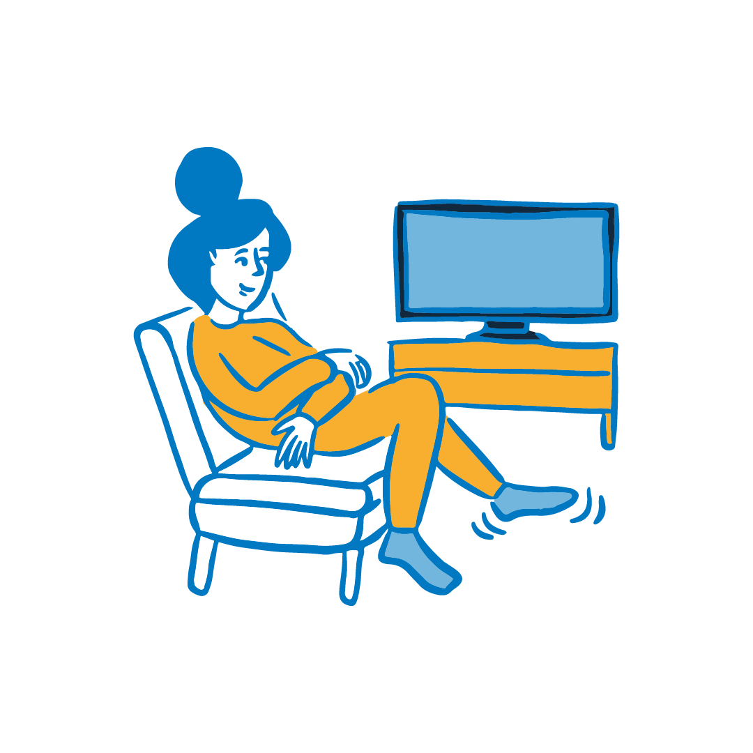 A woman sat watching TV.