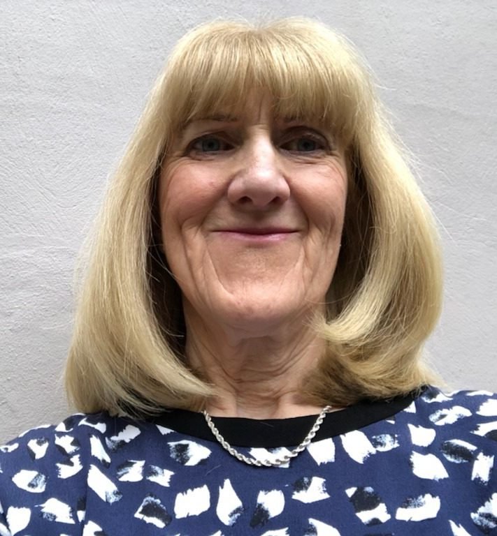 Celia smiling at the camera.