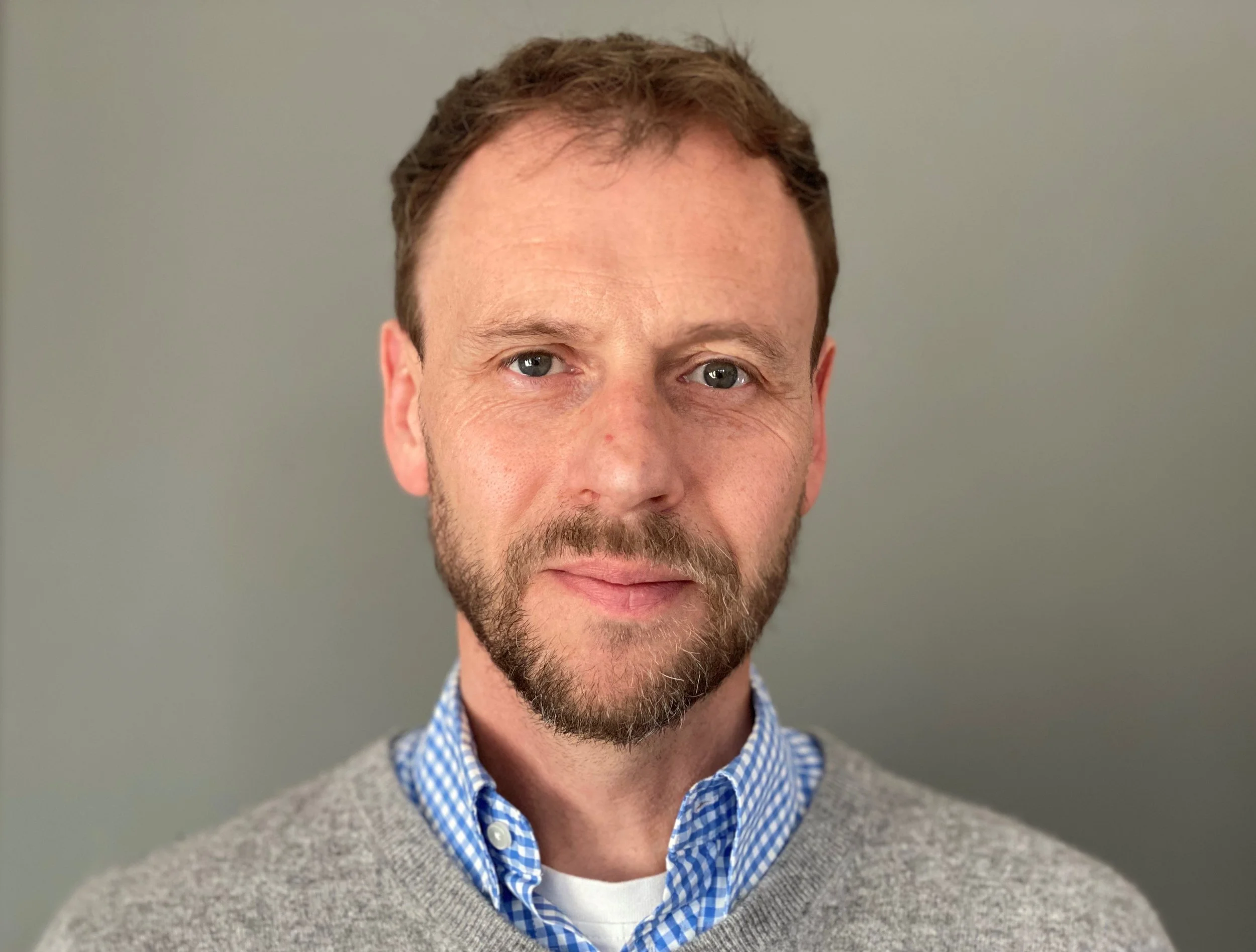 Chris smiling at the camera.