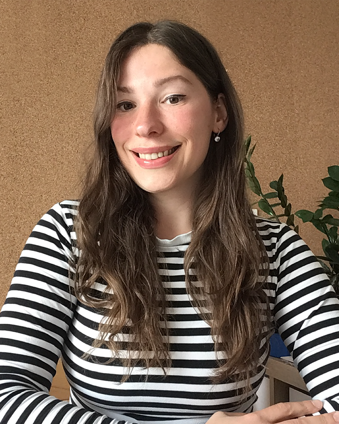 Simona smiling at the camera.