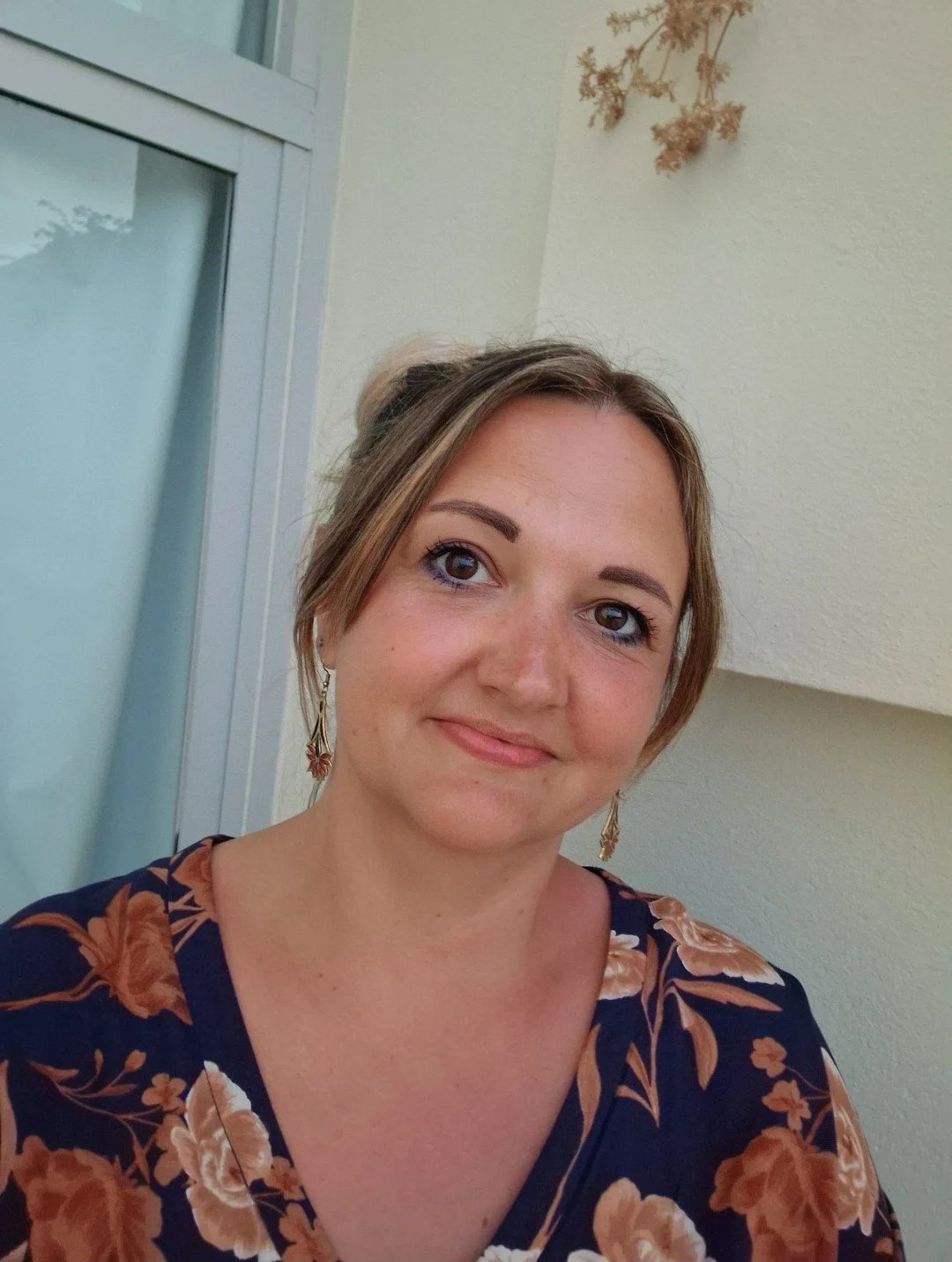 Nikki smiling at the camera.