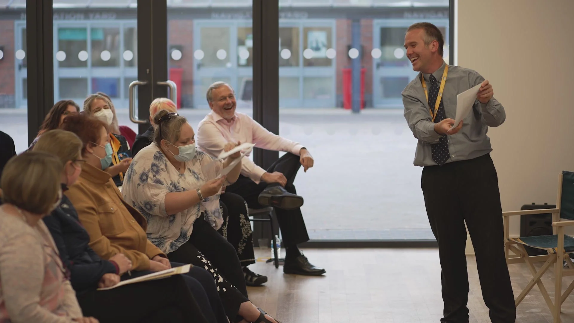 Flippin' Pain speaker Cormac talking to and laughing with an audience..