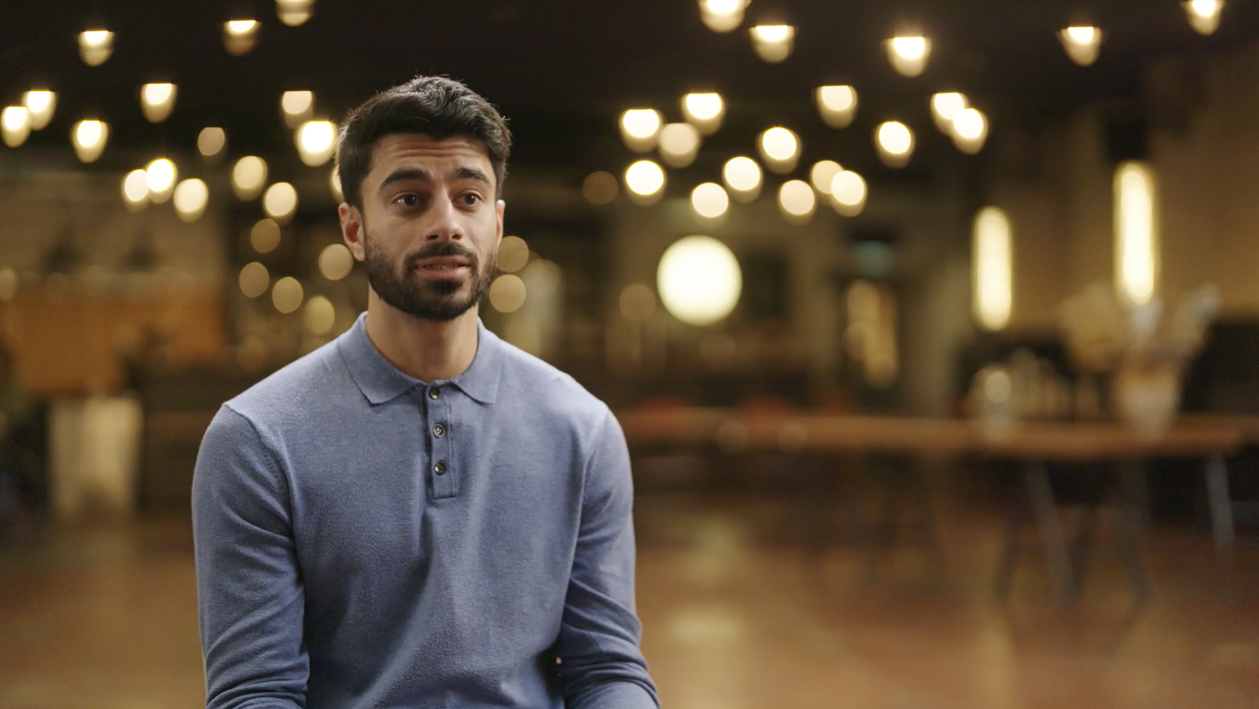 Mahin speaking to camera.