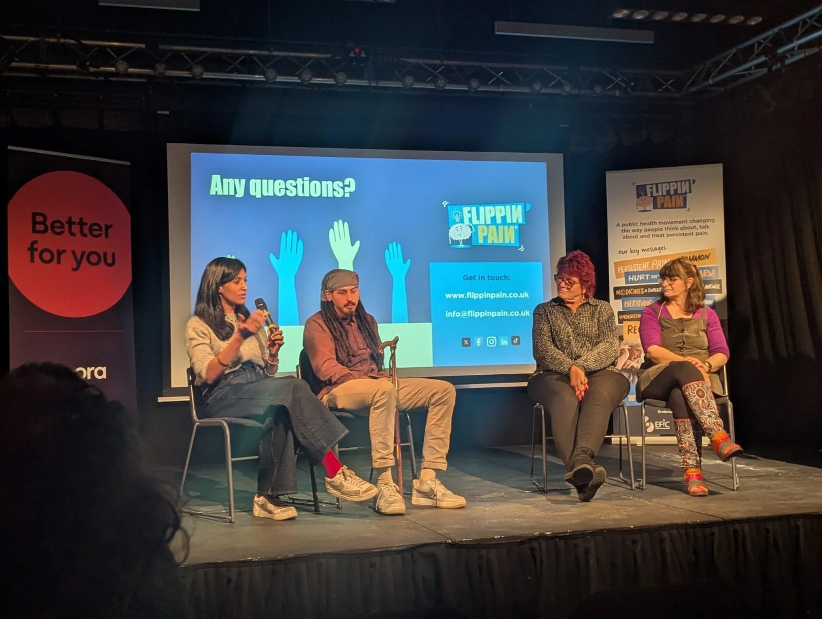 Sashira speaking on a panel at a Flippin' Pain event.