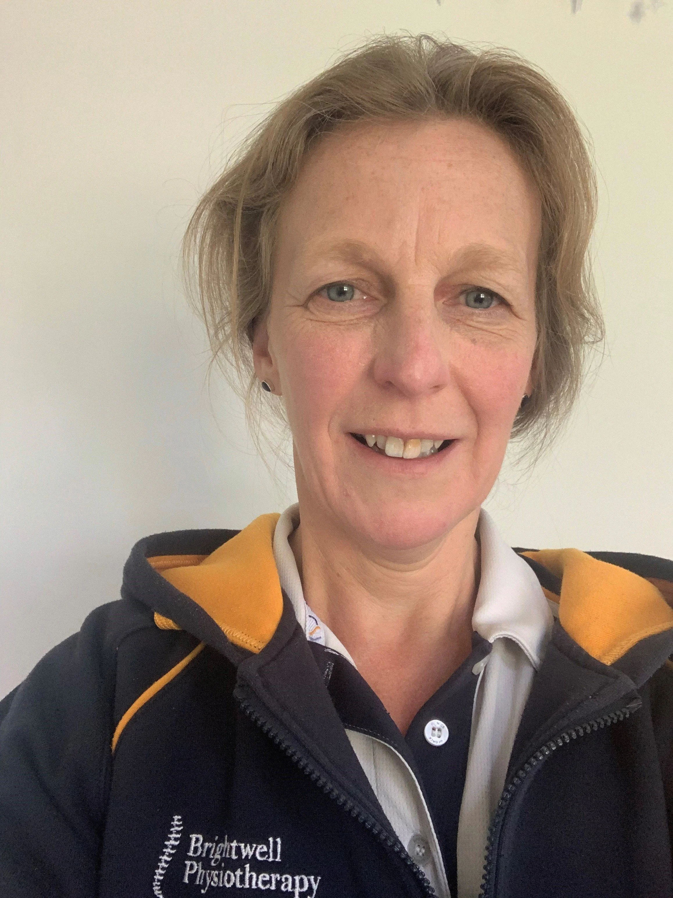 Felicity smiling at the camera.