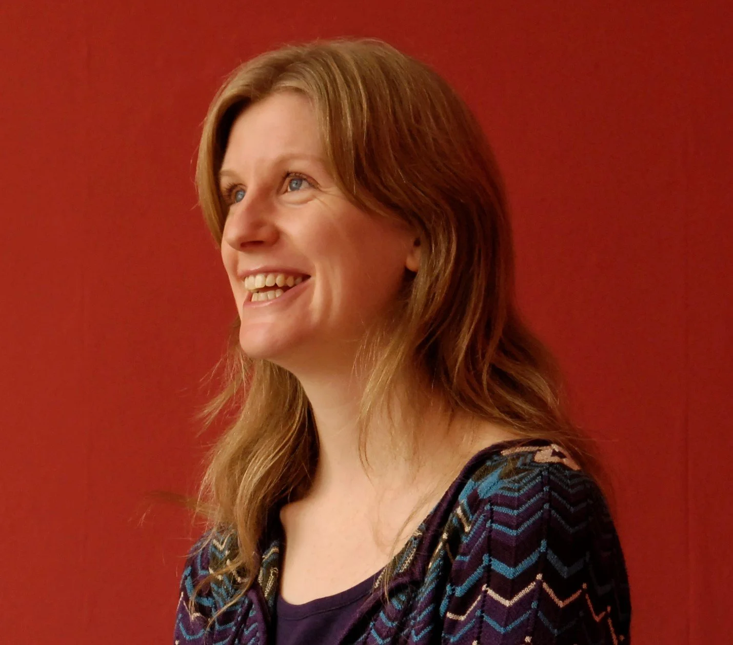 Penny looking up and smiling.