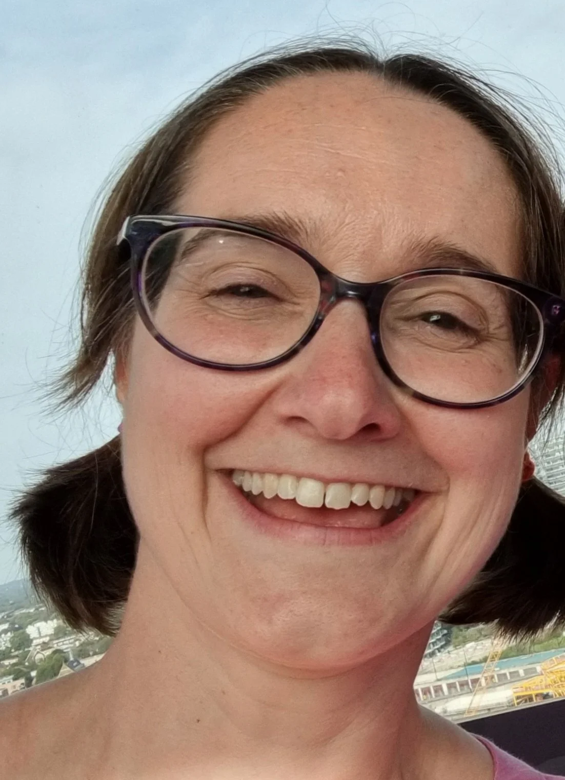 Vicky smiling at the camera.