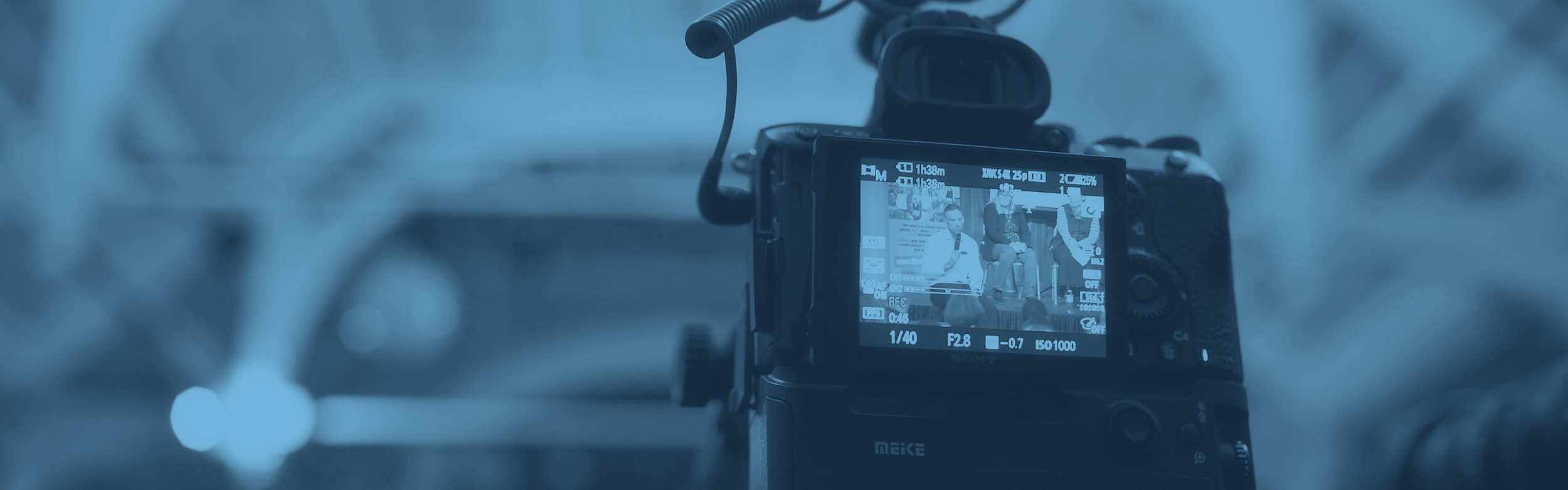 A video camera recording a speech.