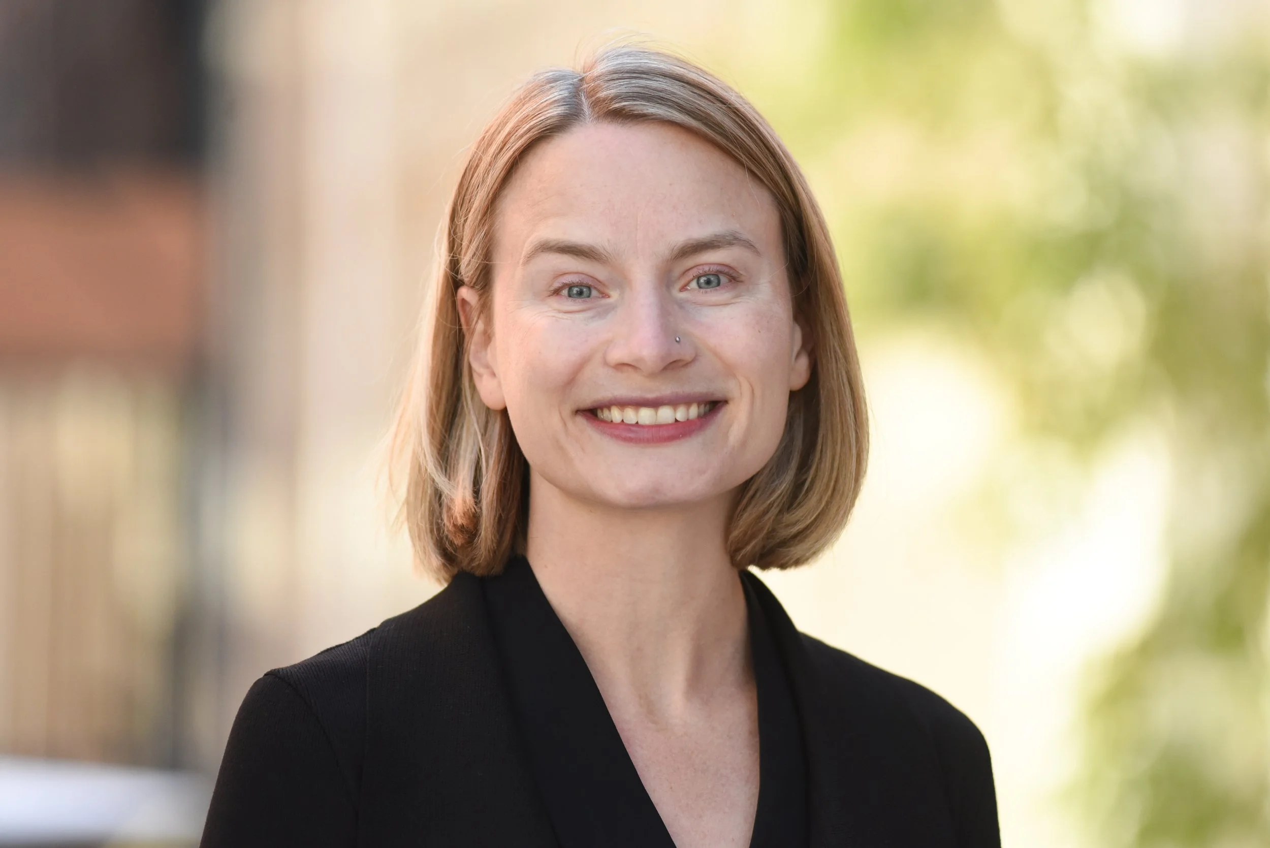 Tasha smiling at the camera.