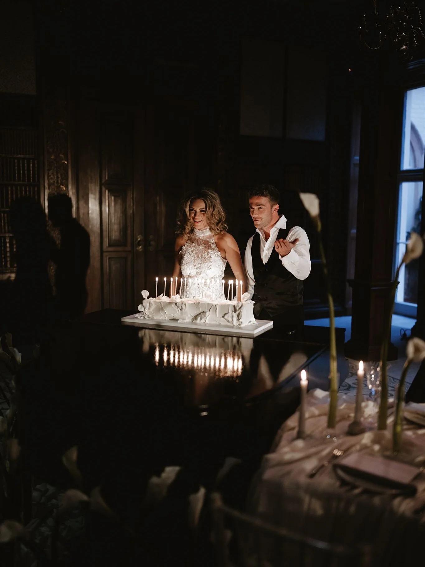 Creating a moment! Make a statement with your wedding cake and of course, a fabulous photo opportunity.

A long style cake with textured buttercream and hand moulded sugar petals, with the added addition of lit slim candles.  Some may say this the &l