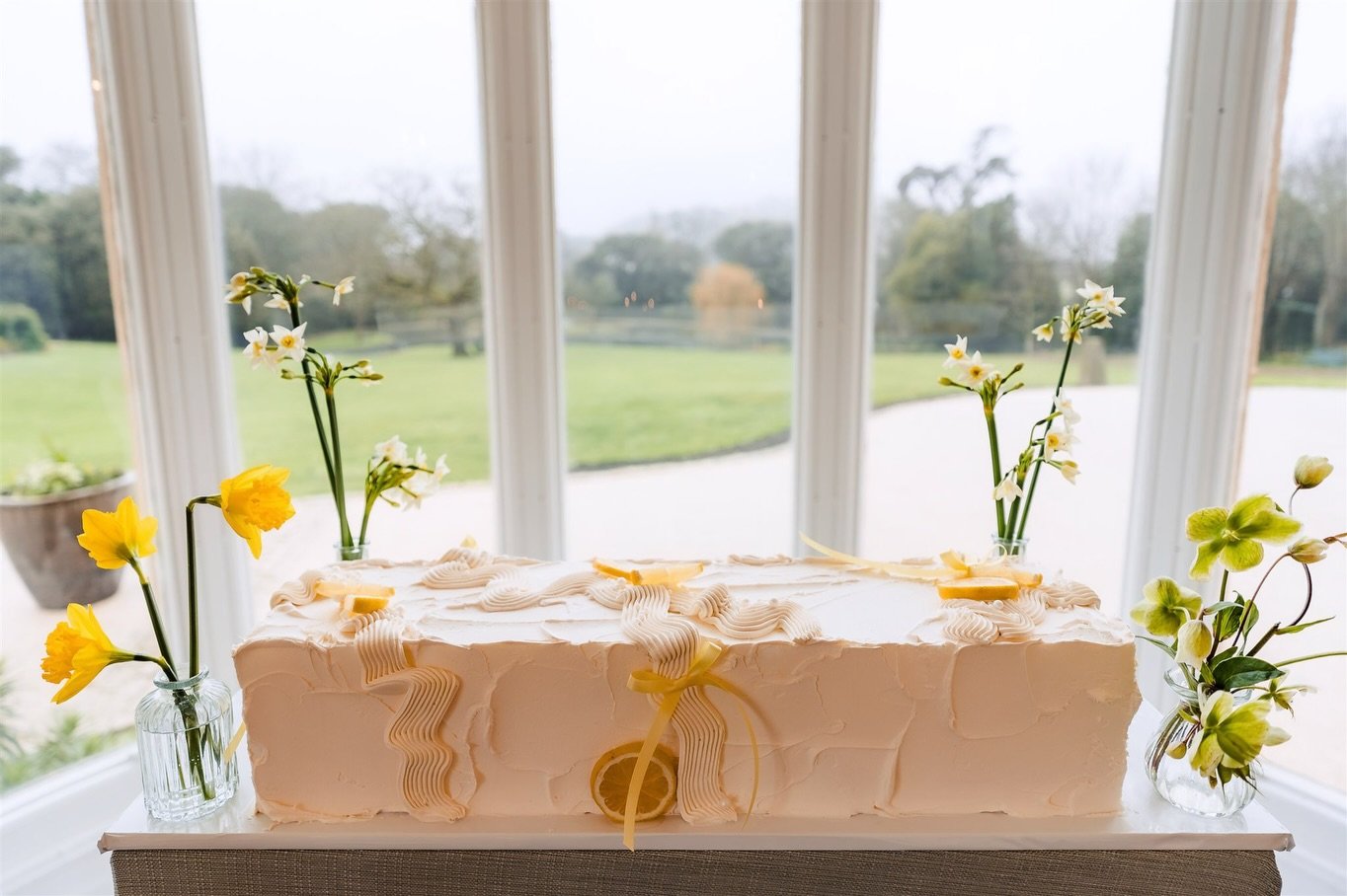 A summer lemon vibe for a fabulous showcase day @clevedonhall A top table show stopper with textured buttercream, fresh lemons and ribbons. 

This is one of the most requested shaped wedding cakes in my inbox for 2026/27 with so many different option