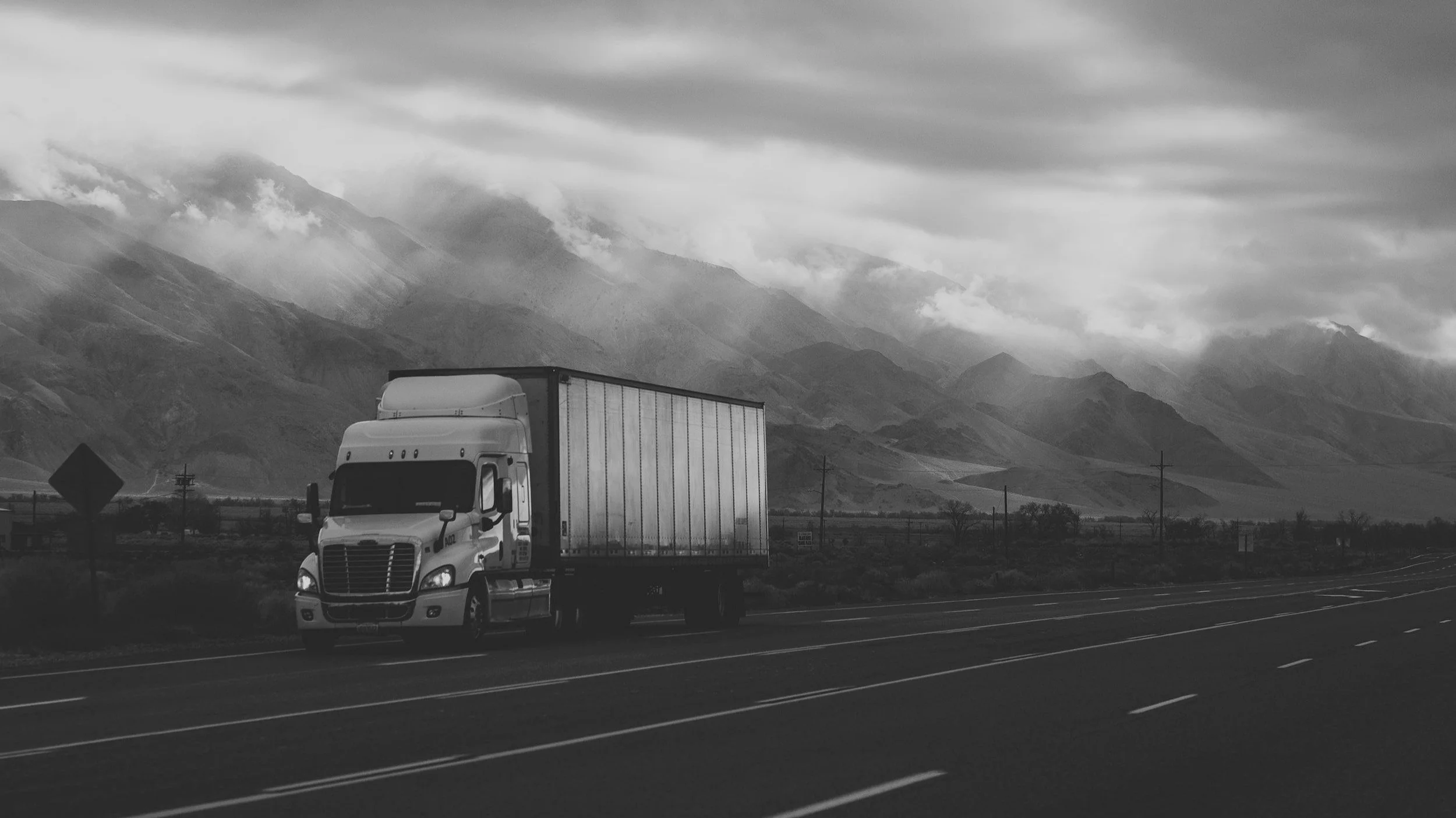 temperature controlled truck passing through a mountain road