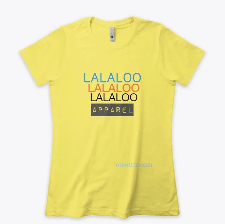 Yellow T-shirt with text 'LALALOO' repeated three times in blue, orange, and black, followed by the word 'APPAREL' in a black box, and a website URL in light blue.