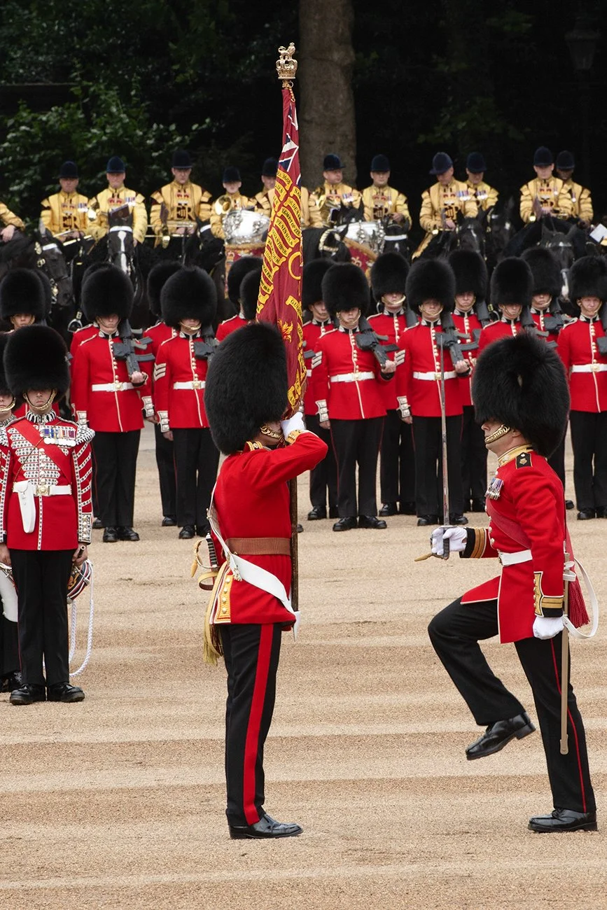The Ensign receives the Queen's Colour from the Regimental Sergeant Major