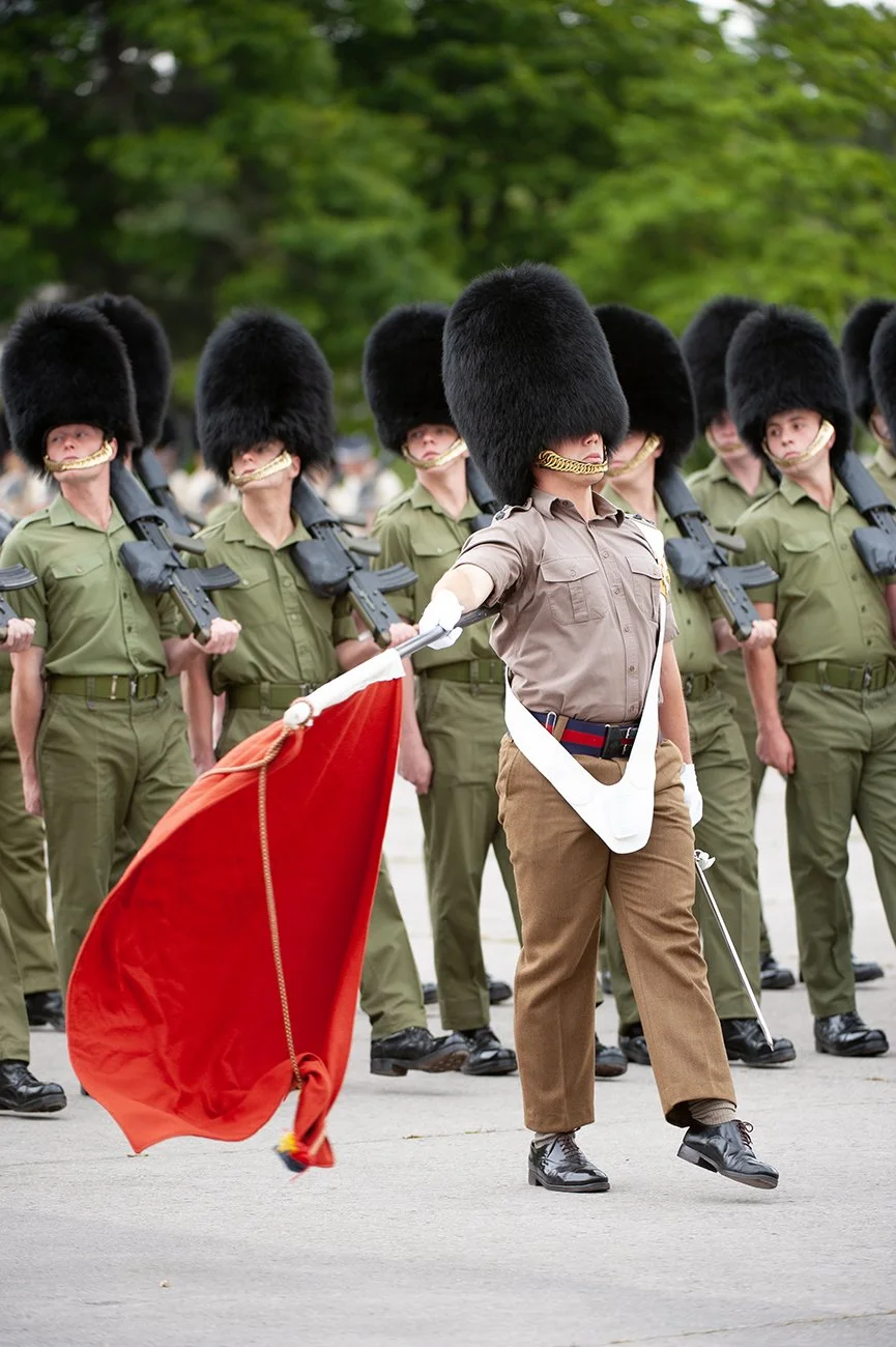 The Ensign flourishing the Colour, rehearsing the march pasting slow-time