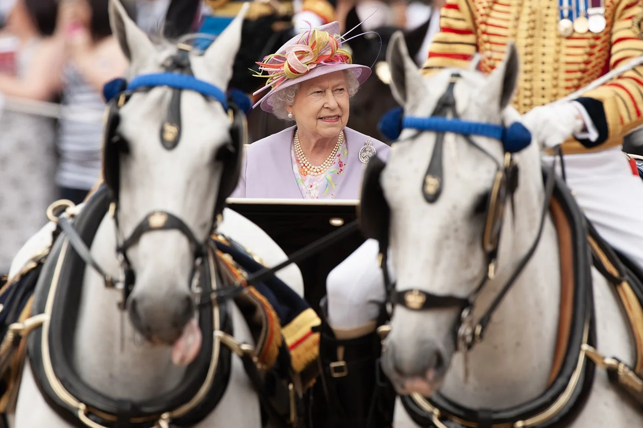 H.M. The Queen reviews the troops from her  landau