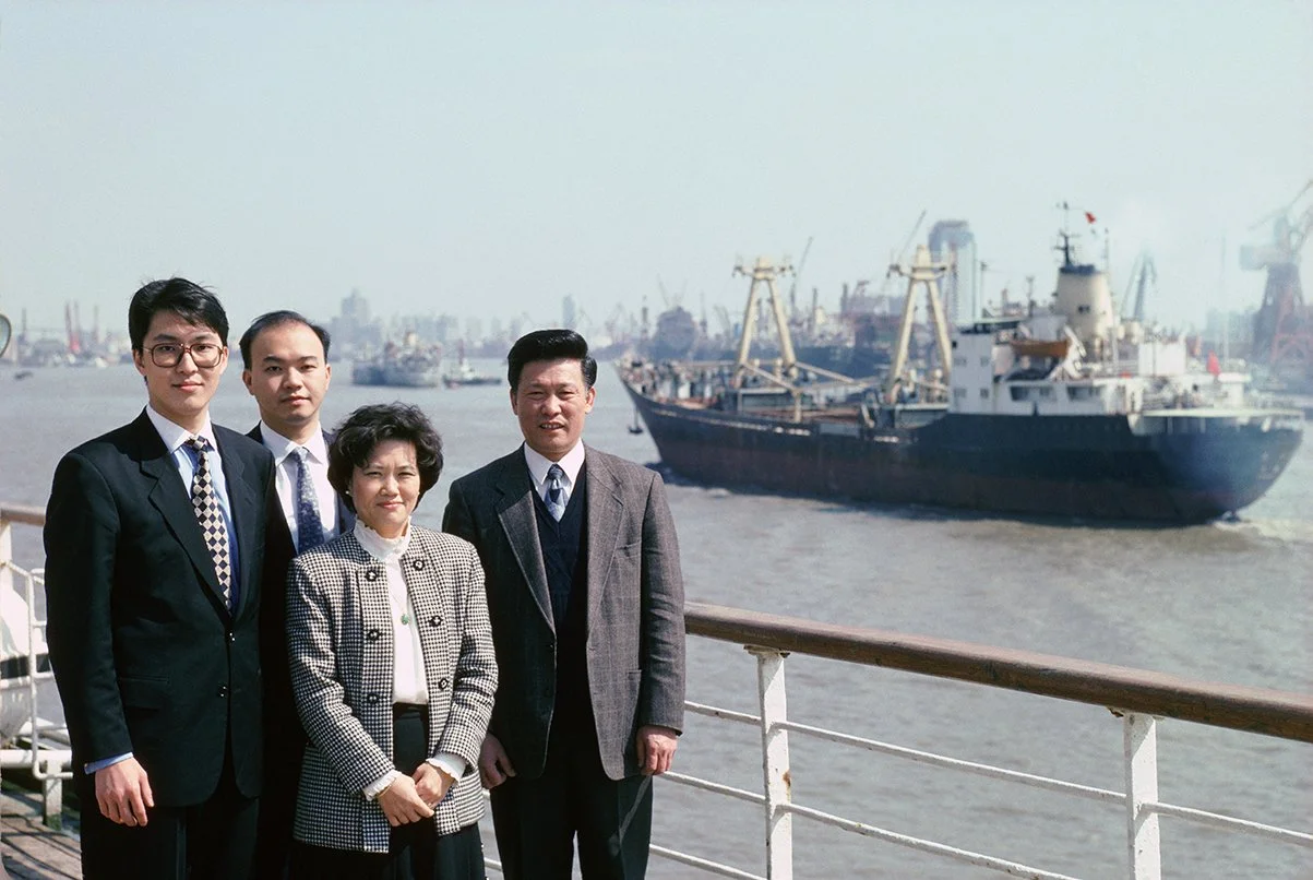 Members of Deutshe Bank's office photographed on the Bund in Shanghai, China