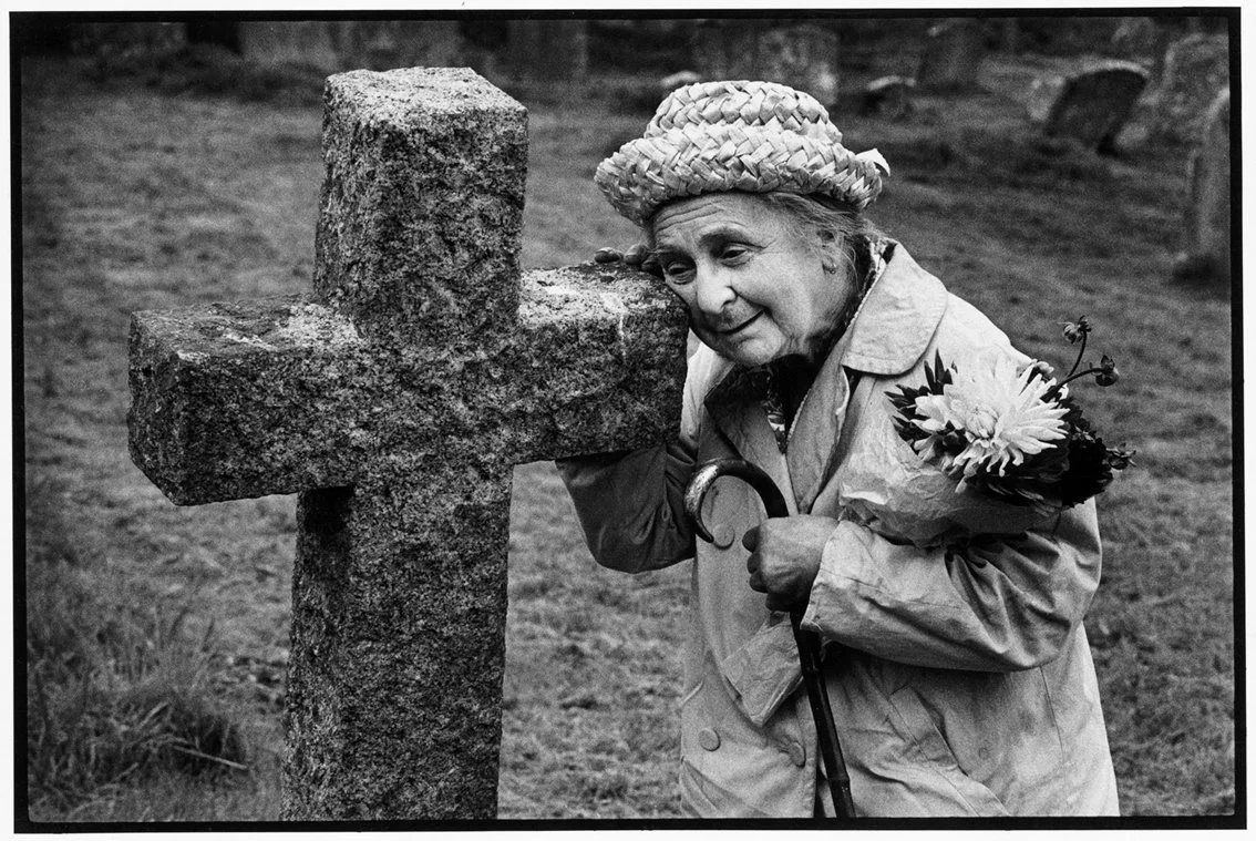 Imber Church on Salisbury Plain.  The village  - now abandoned - is in the middle of an army training ground and is only open to the public on a few days a year. This lady, who is nearly blind,  was born in the village and she is visiting her parents