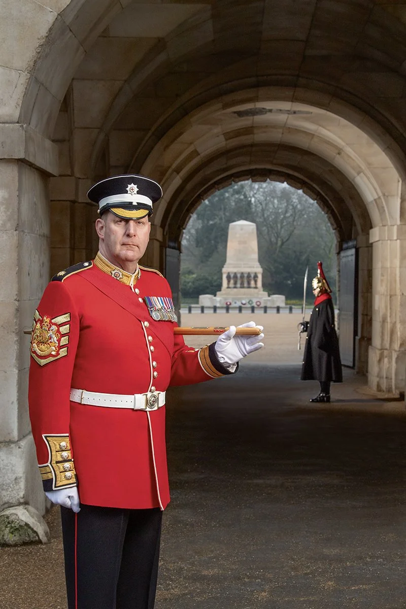 Garrison Sergeant Major Vern Stokes OBE in Tilt Yard Horse Guards. The Blues & Royals trooper in the background guards the entrance to the Household Division's headquarters.