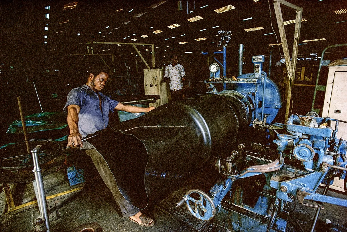 Truck tyres being made in Dunlop's factory in Lagos, Nigeria. This picture was taken on Kodachrome 200 film, it was not around for long but it had wonderful gritty grain, perfect for this type of industrial picture.
