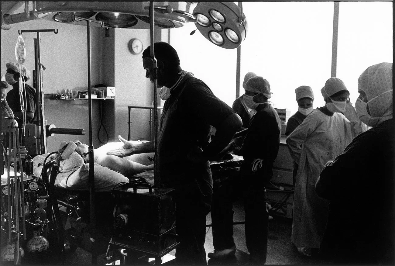 Surgeon checking patient's body temperature