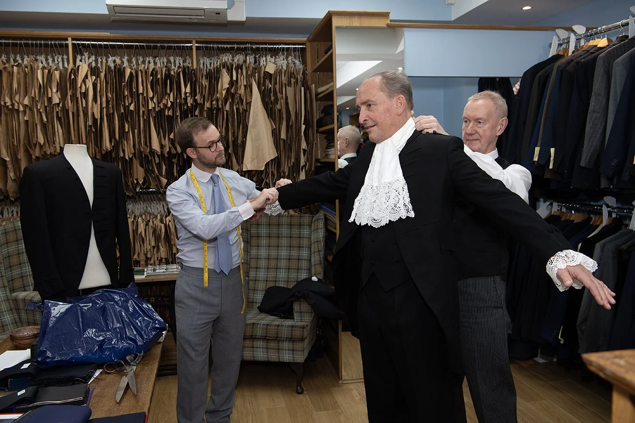 Sir Charles Bowman having the final fitting for his uniform