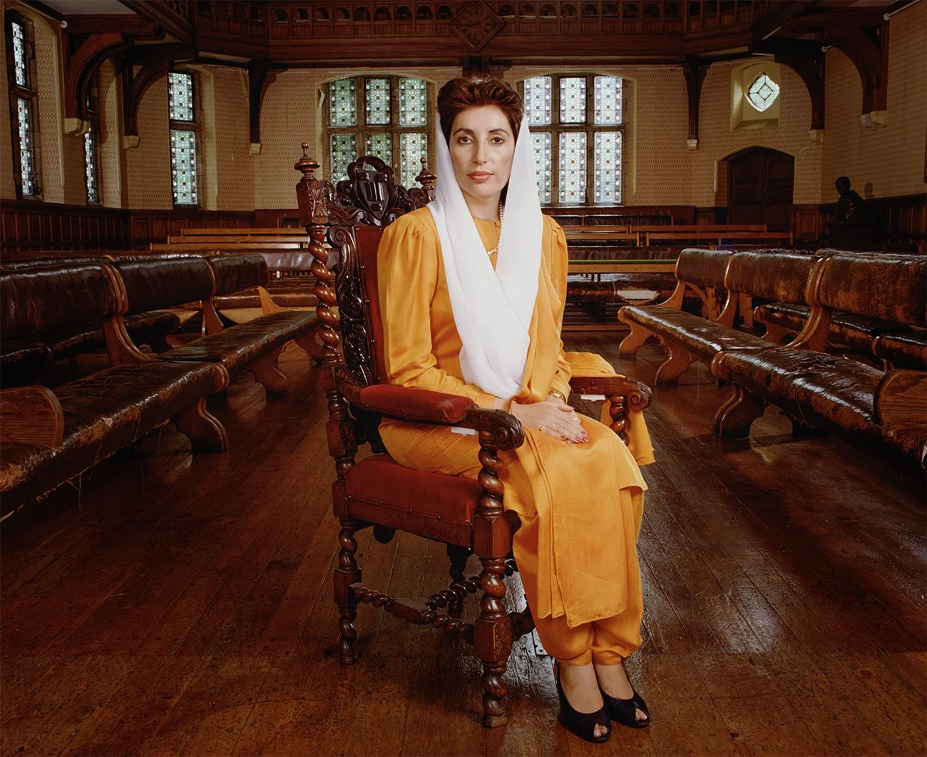 Benazir Bhutto, then Prime Minister of Pakistan, sitting in the President's Chair in the Oxford Union. Her father was also President of Pakistan and both were assassinated.