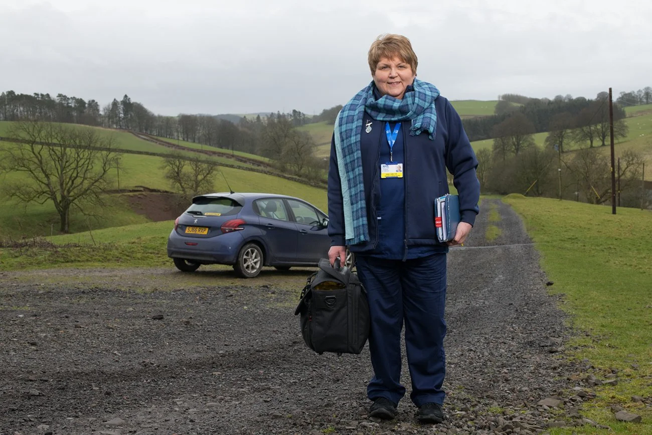 A Queen's Scottish nurse, Hazel Hamilton, on her rounds in the Borders. Her scarf is the Scottish Nurses' tartan 