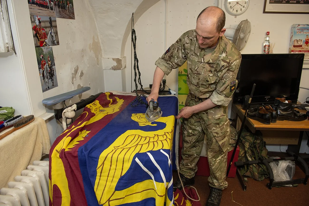 The Royal Standard is prepared for Her Majesty's arrival on the dias on Horseguards. It is unfurled at 11.00 