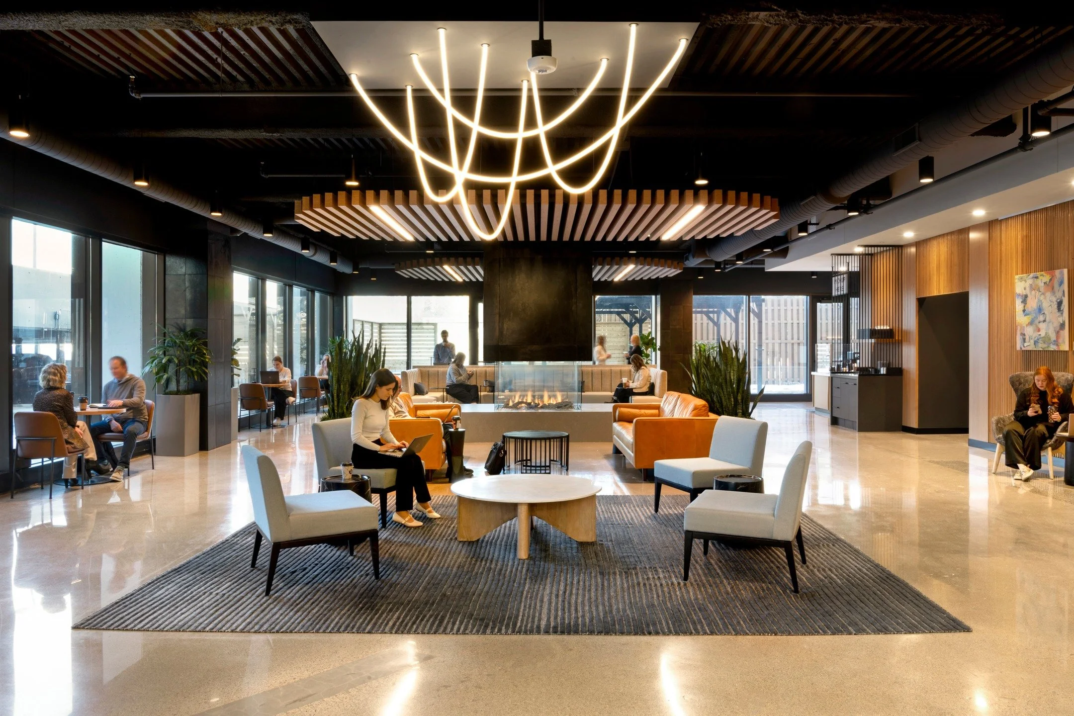 Project Showcase: Wells Fargo Plaza Cafe, Lounge &amp; Wellness Rooms

This new space for Wells Fargo Plaza turned out better than we imagined. Between the beautiful fireplace, the unique hanging light fixture, and the new coffee shop, this is the pe