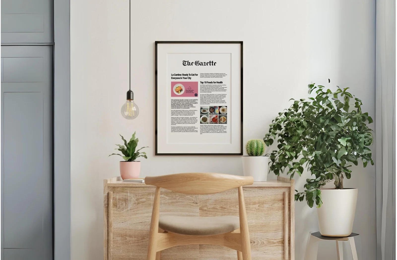 A framed newspaper page from The Gazette hanging above a wooden desk